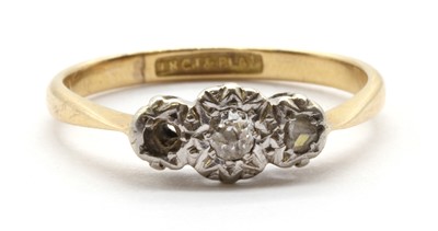 Lot 110 - A gold three stone diamond ring