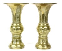 Lot 205 - A pair of Chinese brass gu vases