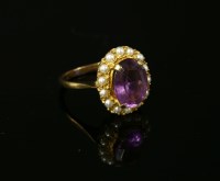 Lot 7 - A 9ct gold oval mixed cut amethyst and seed pearl cluster ring
