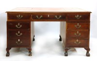 Lot 605 - A George III style mahogany pedestal partners desk