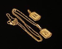 Lot 55 - Two high carat gold initial pendants
