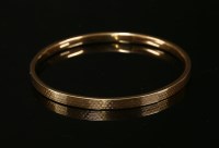 Lot 20 - A 9ct gold hollow flat section slave bangle