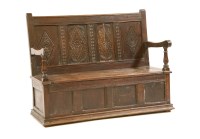 Lot 503 - A late 19th century carved oak settle