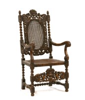 Lot 610 - An early 20th century carved throne chair