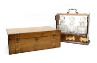 Lot 402 - An early 20th century oak cased three division tantalus