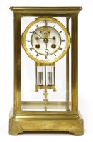 Lot 1020 - A Victorian brass four-glass mantel clock