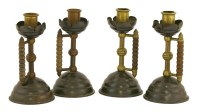 Lot 823 - A group of four Christopher Dresser designed chamber candlesticks