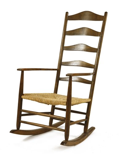 Lot 66 - A stained ash ladder back rocking chair