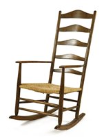 Lot 66 - A stained ash ladder back rocking chair