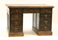 Lot 496 - A 17th century style carved oak pedestal desk