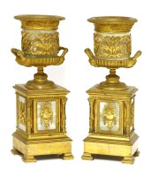 Lot 915 - A pair of turned onyx and ormolu-mounted urns