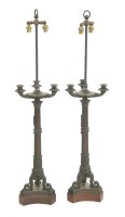 Lot 826 - A pair of Regency bronze three-light candelabra