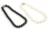 Lot 63 - A single row simulated pearl necklace