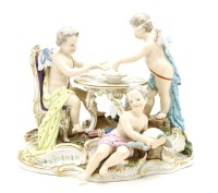 Lot 396 - A late 19th century Meissen fortune teller group of three cherubs