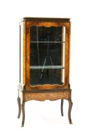 Lot 612 - A Louis XV style kingwood and ebonised vitrine