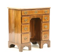 Lot 556 - Walnut kneehole desk