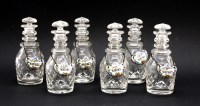 Lot 136 - Six early 20th century miniature cut glass ring necked decanters