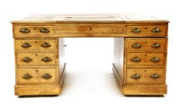 Lot 589 - An oak veneer pedestal desk