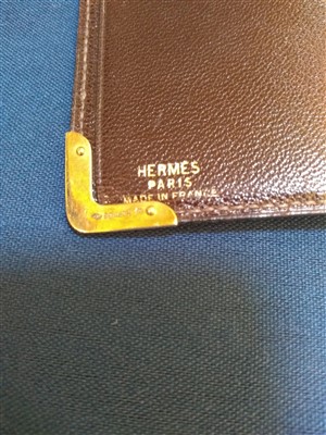 Lot 753 - An Hermès of Paris chocolate brown crocodile skin bill fold