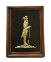 Lot 186 - A cast brass relief of an East India Company man standing holding a stick