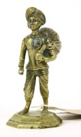 Lot 162 - A cast brass figure of a Sikh sepoy with a sack over his shoulder
