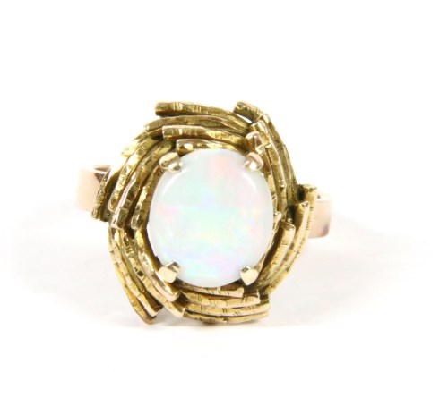 Lot 8 - A gold single stone cabochon opal ring