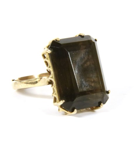 Lot 11 - A 9ct gold single stone smokey quartz ring