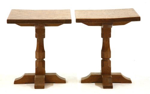 Lot 557 - A pair of Mouseman style oak lamp tables