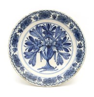 Lot 242A - An 18th century tin glazed blue and white charger