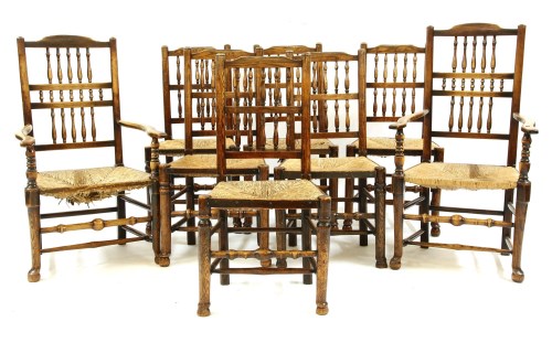 Lot 569 - A set of eight 18th century elm and oak dining chairs