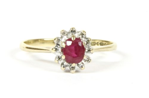 Lot 15 - A 9ct gold ruby and diamond cluster ring