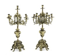 Lot 355 - A pair of 19th century style brass six branch candelabra