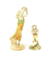 Lot 195 - A Hadley's Royal Worcester figure of a young woman playing a tambourine