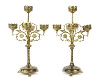 Lot 399 - A pair of Gothic brass five-light candelabrum