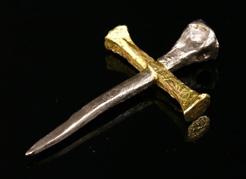 Lot 250 - A yellow and white gold cross by Kim Gioielli
