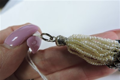 Lot 156 - A Belle Époque pearl, diamond and seed pearl tassel