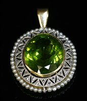 Lot 155 - A Belle Époque peridot, diamond and seed pearl pendant