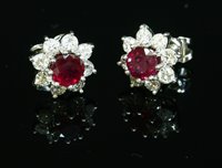Lot 520 - A pair of 18ct white gold ruby and diamond cluster earrings