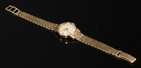 Lot 607 - A ladies' 9ct gold Omega automatic strap watch