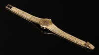 Lot 606 - A ladies' 9ct gold Omega mechanical bracelet watch