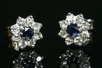 Lot 502 - A pair of gold sapphire and diamond circular cluster earrings
