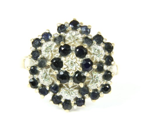 Lot 38 - A 9ct gold sapphire and diamond three tier ring