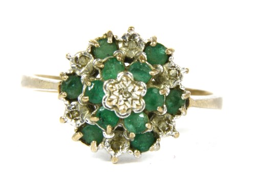 Lot 45 - A 9ct gold emerald and diamond three tier cluster ring