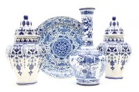 Lot 320 - A pair of blue and white Delft lidded temple jars