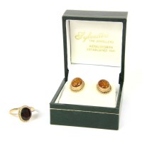 Lot 36 - A pair of 9ct gold oval cabochon amber earrings