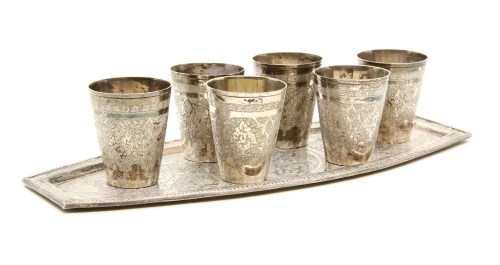 Lot 130 - A Persian white metal set of six shot beakers