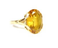 Lot 41 - A French gold single stone oval cut yellow synthetic Corundum ring