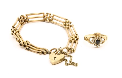 Lot 2 - A gold three row gate link bracelet with padlock