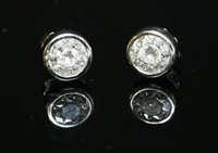 Lot 467 - A pair of 18ct white gold diamond set stud earrings