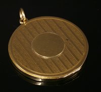 Lot 104 - An Edwardian flat section gold hinged locket